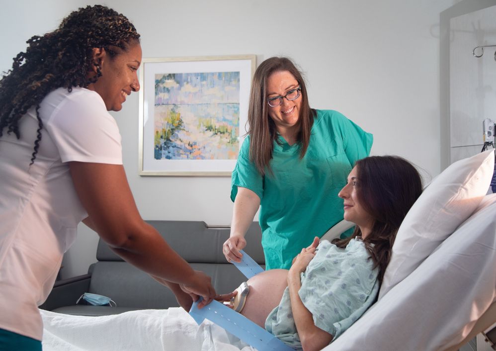 A nurse and physician care for an expectant mother in Labor & Delivery.