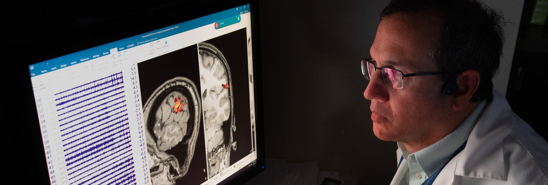 Dr. Juan G. Ochoa, M.D., analyzes a patient's test results in the Epilepsy Monitoring Unit at University Hospital.