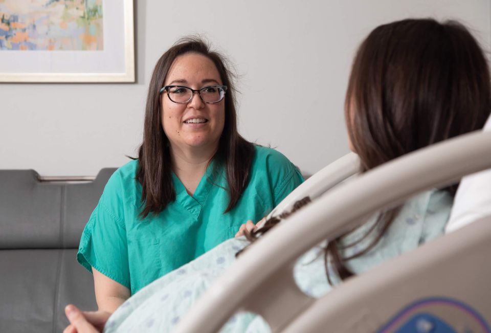 Nicolette P. Holliday, M.D., F.A.C.O.G., meets with a patient.